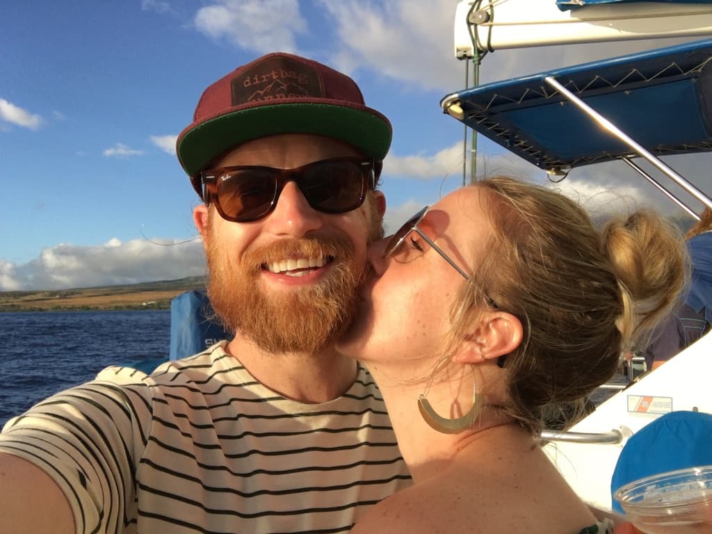 Lindsay kissing Garrett on a boat